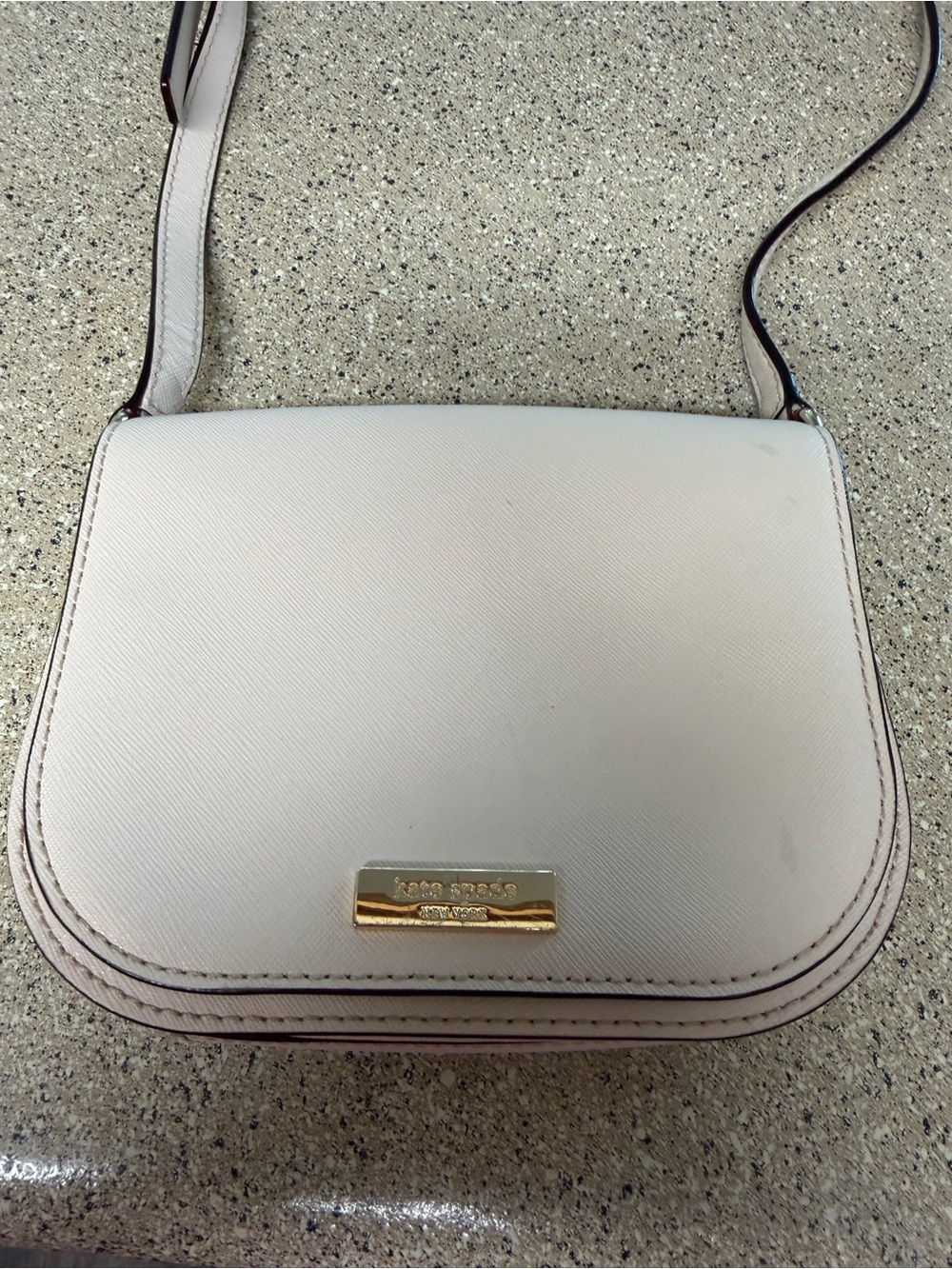kate spade cream pebbled leather crossbody with gold plaque